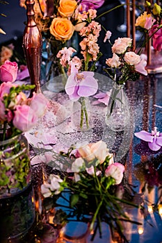 Flowers. Candles. Sunset. Wedding decoration. Floral arrangements