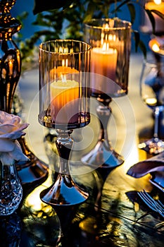 Flowers. Candles. Sunset. Wedding decoration. Floral arrangements