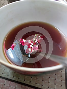 Flowers in the cap of coffee