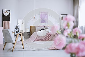 Flowers in chic pink bedroom