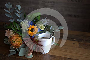 Flowers with coffee cup photo