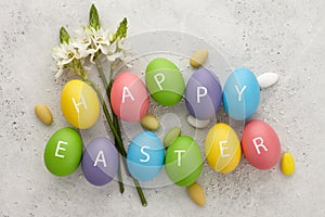 Flowers and colorful Easter eggs with letters