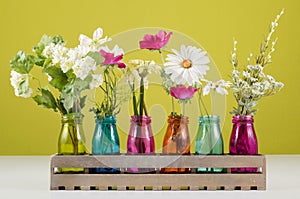 Flowers in colorful vases