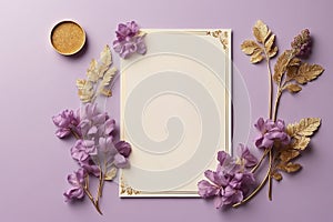 Flowers composition, blank paper sheet, golden frame, dried flowers on purple background