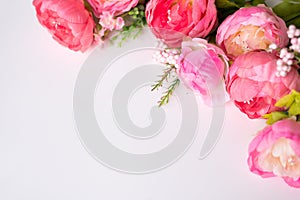 Flowers composition. Frame made of pink peony flowers on white background. Flat lay, top view