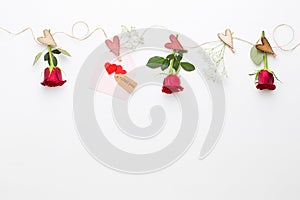 Flowers composition. Frame made of red rose on white background. Flat lay, top view, copy space