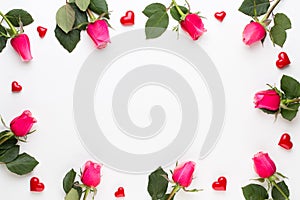 Flowers composition. Frame made of red rose on white background. Flat lay, top view, copy space