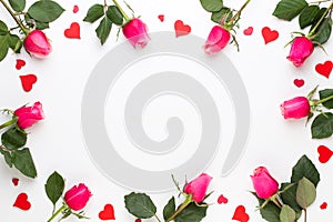 Flowers composition. Frame made of red rose on white background. Flat lay, top view, copy space