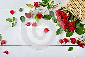 Flowers composition. Red roses on a white wooden background. Fla