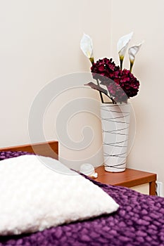 Flowers in cosy bedroom photo