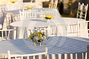 Flowers decoration on white table outdoor in  wedding reception