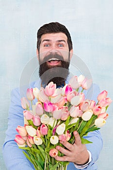 Flowers delivery. Gentleman romantic date. Birthday greetings. Best flowers for girlfriend. Spring holiday. Man bearded