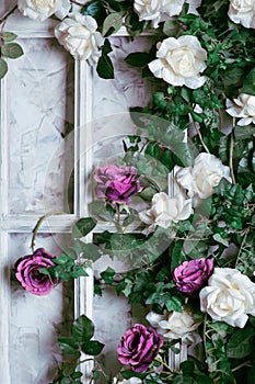 Flowers in a frame on the wall for wedding decoration