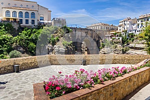 Flowers in front of the historic Puente Nuevo bridge in Ronda