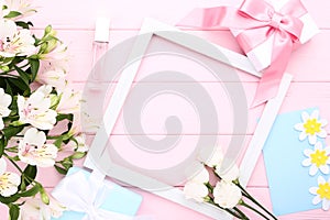 Flowers with gift boxes, perfume bottle and frame