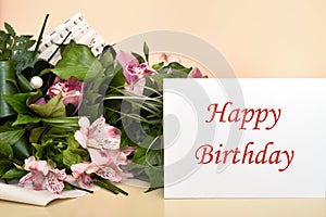 Flowers and greeting card with Happy Birthday message