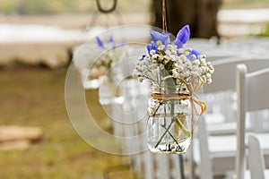 Flowers hanging in mason jar