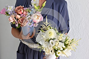 flowers in hat box. woman with a bouquet of flowers. online catalog of flower delivery shop. plant composition