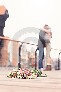 Flowers and hugging couple