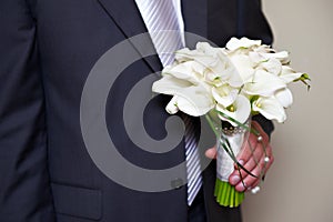 Flowers Kala in hand of groom