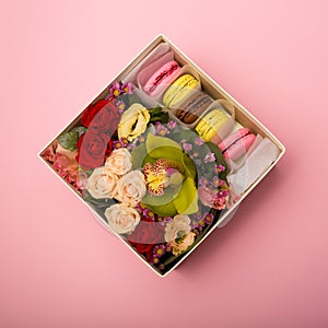 Flowers and macaroons in a hat-box