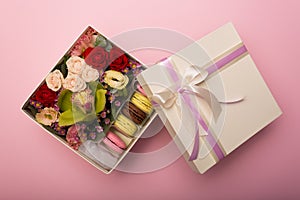 Flowers and macaroons in a hat-box