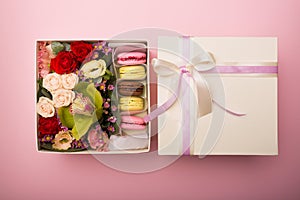 Flowers and macaroons in a hat-box