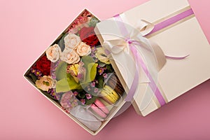 Flowers and macaroons in a hat-box