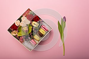 Flowers and macaroons in a hat-box