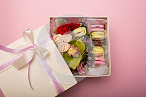 Flowers and macaroons in a hat-box