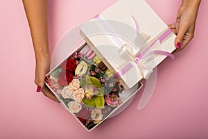 Flowers and macaroons in a hat-box