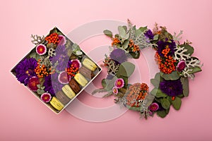 Flowers and macaroons in a hat-box