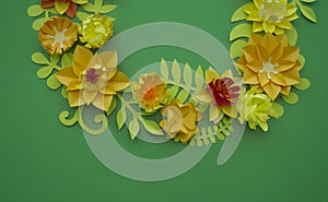 Flowers made of paper. Green background