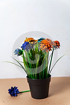 Flowers made of pine cones and artificial grass