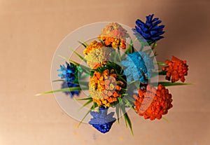 Flowers made of pine cones and artificial grass