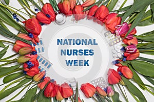Flowers, phonendoscope and tablets - a banner with inscription Happy Nurse's Week on white.