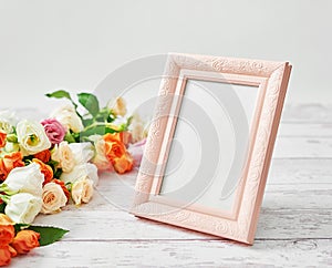 Flowers and photo frame, women`s day. Mother`s day greeting card. Bouquet of flowers eustoma and roses in vase. Happy Birthday!