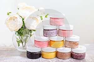 Flowers and a pyrmid of body scrub jars