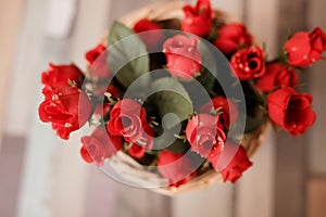 Flowers roses on wooden floor as decor for baby`s birthday celebration. Cake Smash. Spring decor.