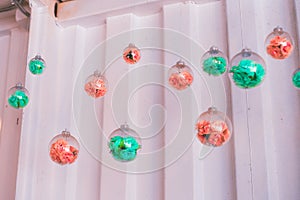 Flowers in a round glass, pastel colors