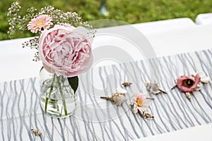 Flowers settings decoration outdoor setup for wedding with pink colored flower