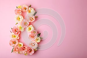 Flowers in the shape of number 8 on a colored background with place for text