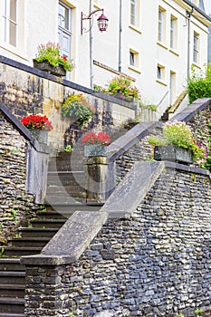 Flowers on the stairs leading to a house in Bouillon