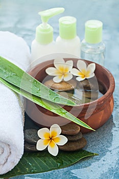 Flowers, stones and cosmrticsfor massage treatment