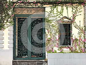 Flowers surround doors and windows