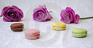 Flowers and sweets macaroons a light background