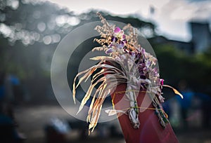 Flowers tied on the prow of a traditional fishing boat to pay respects for a good harvest begin to wither in Jomtien beach