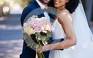 Flowers, wedding and marriage with a bride and groom posing outdoor for a photograph at their celebration event or