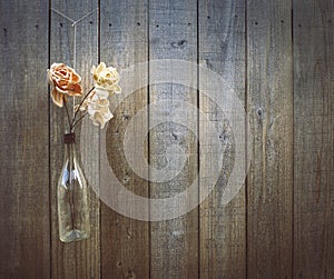 Flowers on a wooden fence background, copy space.