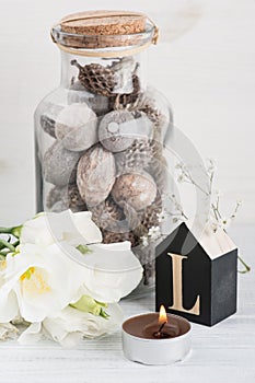 Flowers and wooden letter L on white table